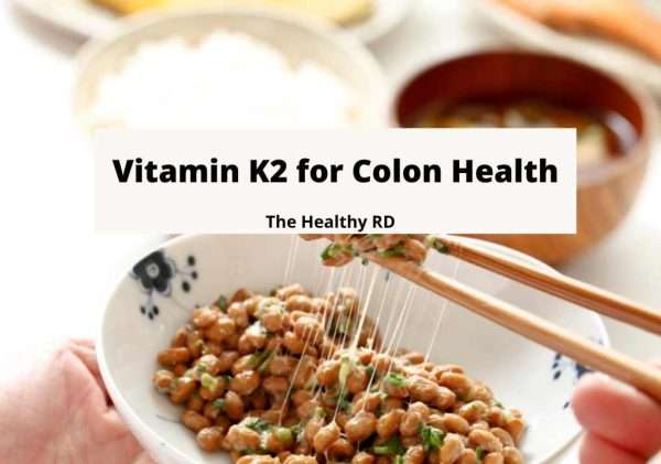 Image of vitamin K2 rich natto in a white bowl with writing Vitamin K2 for colon health by The Healthy RD